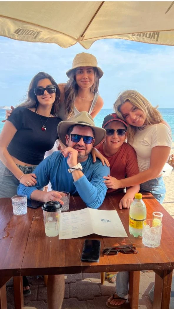Juan Carlos Cuevas, founder of Amigo Vans, with his family